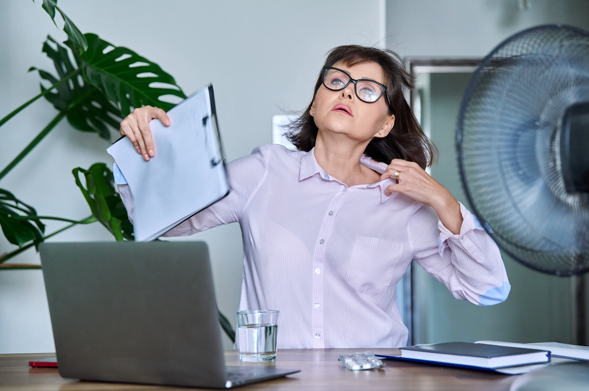 Woman suffering from hot-flashes