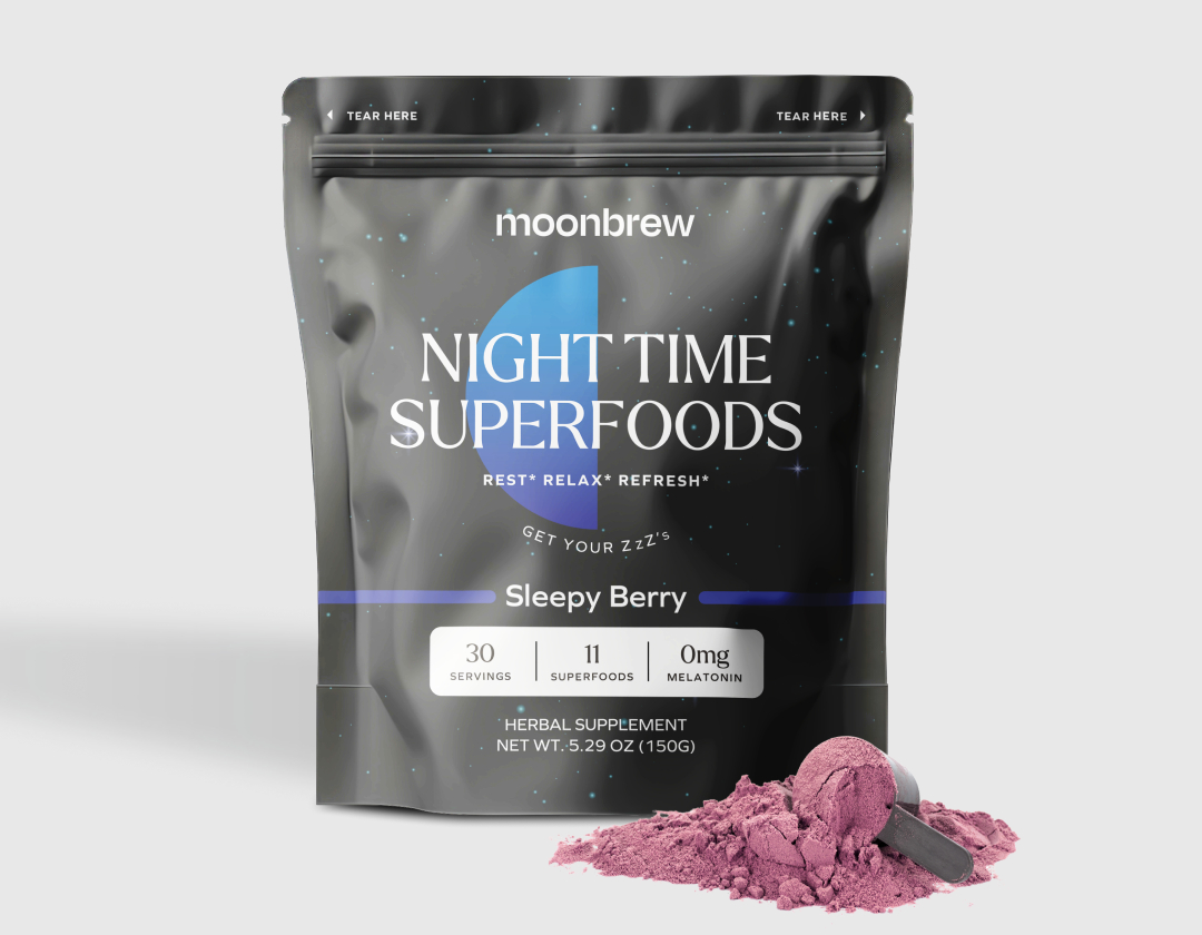 Package of Moonbrew Night Time Superfoods hot cocoa with spilled powder and scoop.